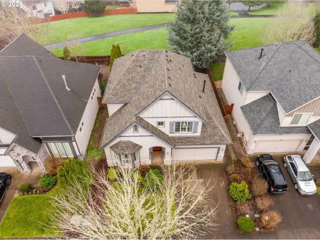 an aerial view of a house with a garden and plants