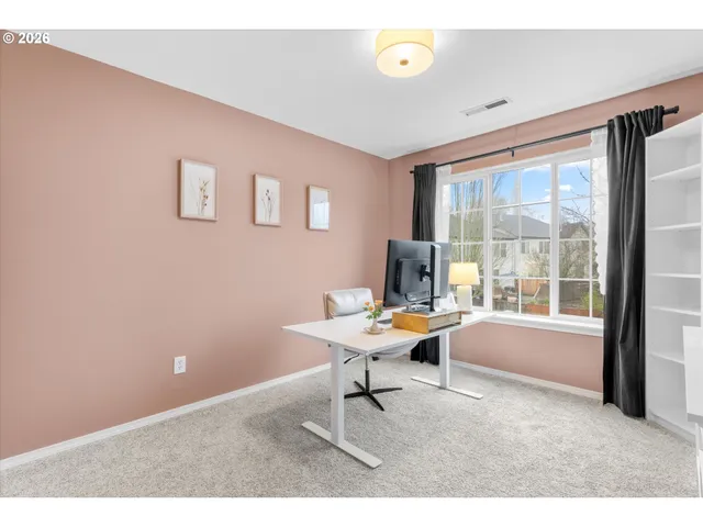 a work room with furniture and a window