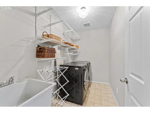 a bathroom with a sink a mirror and shower