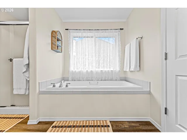 a bathroom with a bathtub and a sink