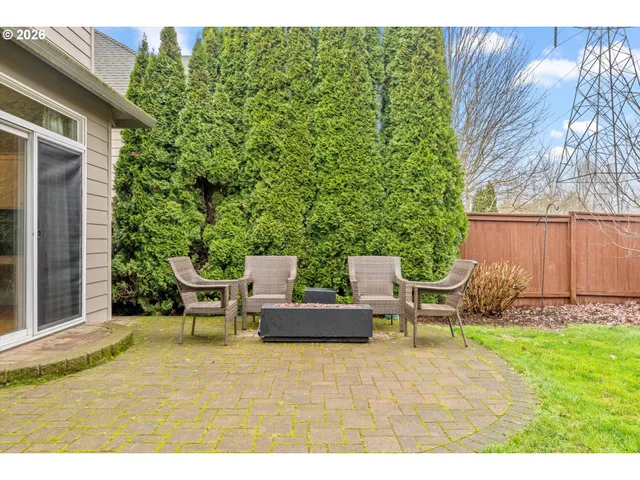 a backyard of a house with outdoor seating