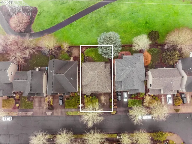 an aerial view of a house with outdoor space