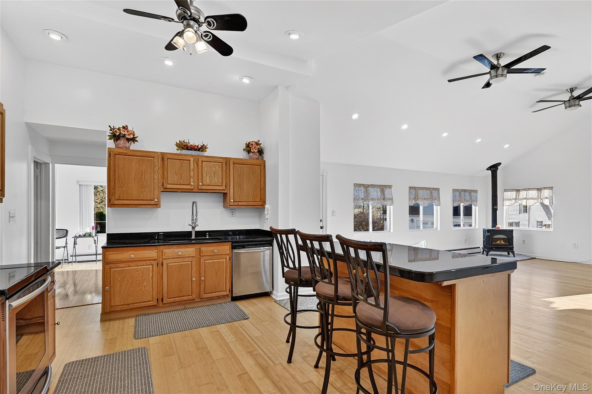 17 Pine Hill Road Highland Mills, NY 10930 - Photo 42 of 43 a kitchen with stainless steel appliances granite countertop counter space dining table and chairs