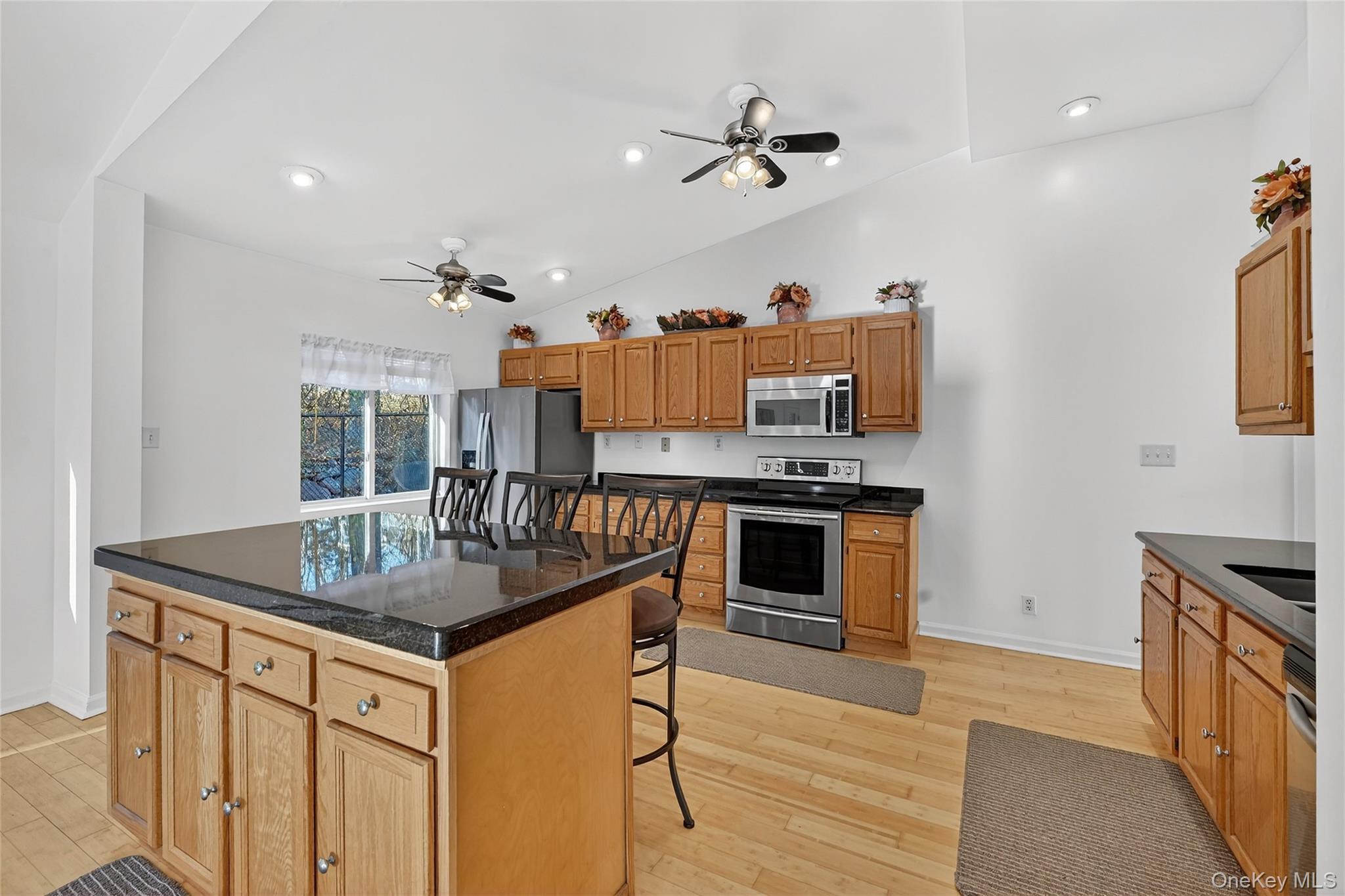 17 Pine Hill Road Highland Mills, NY 10930 - Photo 27 of 43 a kitchen with stainless steel appliances granite countertop a sink a stove and a refrigerator