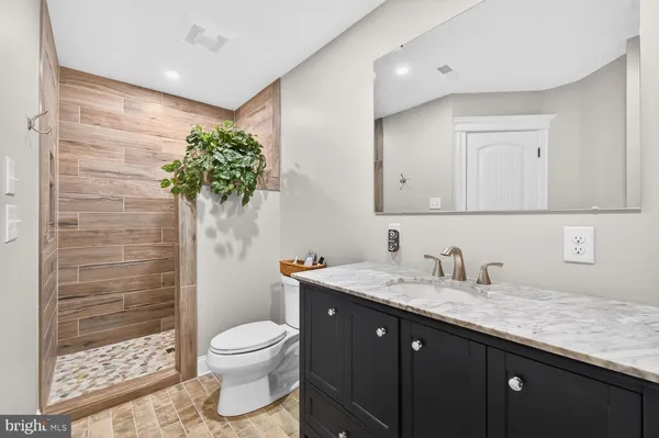 a large bed in a white room