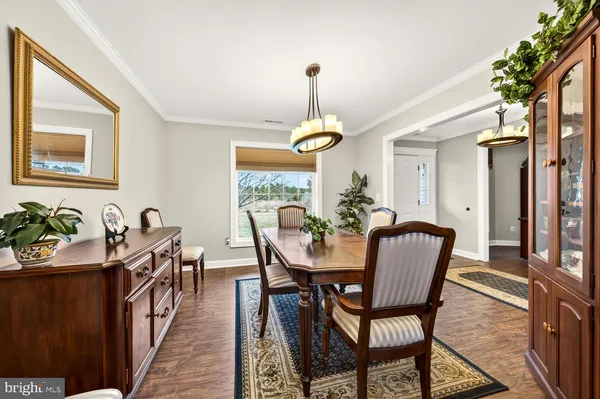 a view of a dining room with furniture and window