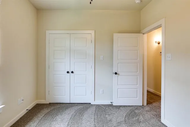 an empty room with closet area