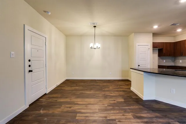 a view of a kitchen with a sink and dishwasher in it