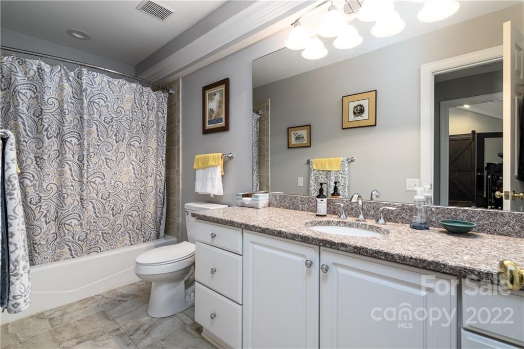3364 Blue Jay Pass Fort Mill, SC 29708 - Photo 14 of 30 a bathroom with a granite countertop sink toilet and shower