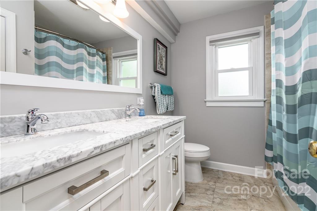 3364 Blue Jay Pass Fort Mill, SC 29708 - Photo 16 of 30 a bathroom with a granite countertop sink mirror vanity and toilet