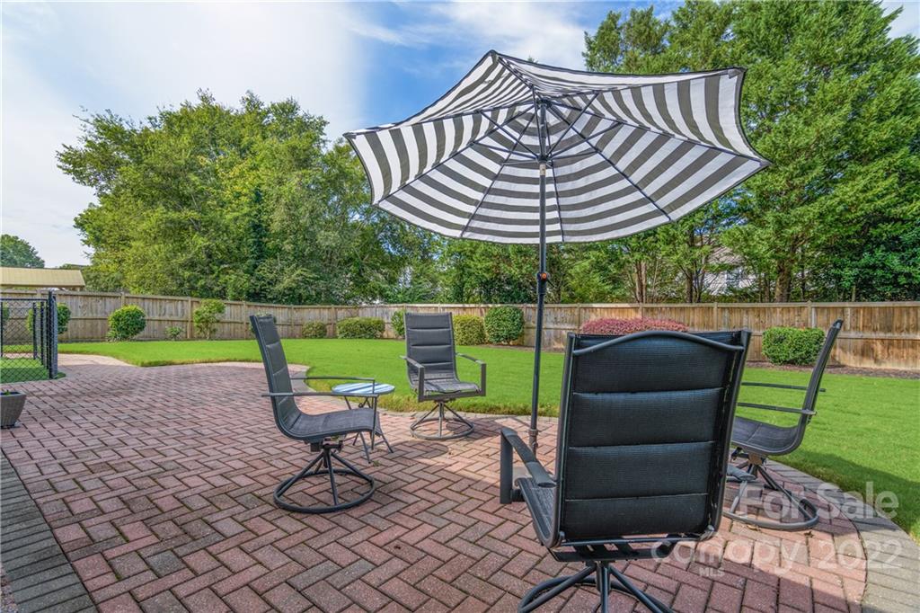 3364 Blue Jay Pass Fort Mill, SC 29708 - Photo 20 of 30 a view of a chair and tables in the backyard