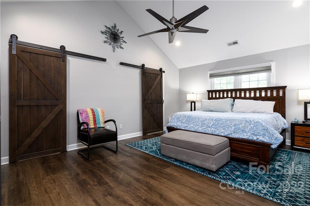 3364 Blue Jay Pass Fort Mill, SC 29708 - Photo 9 of 30 a bedroom with a bed window and a ceiling fan
