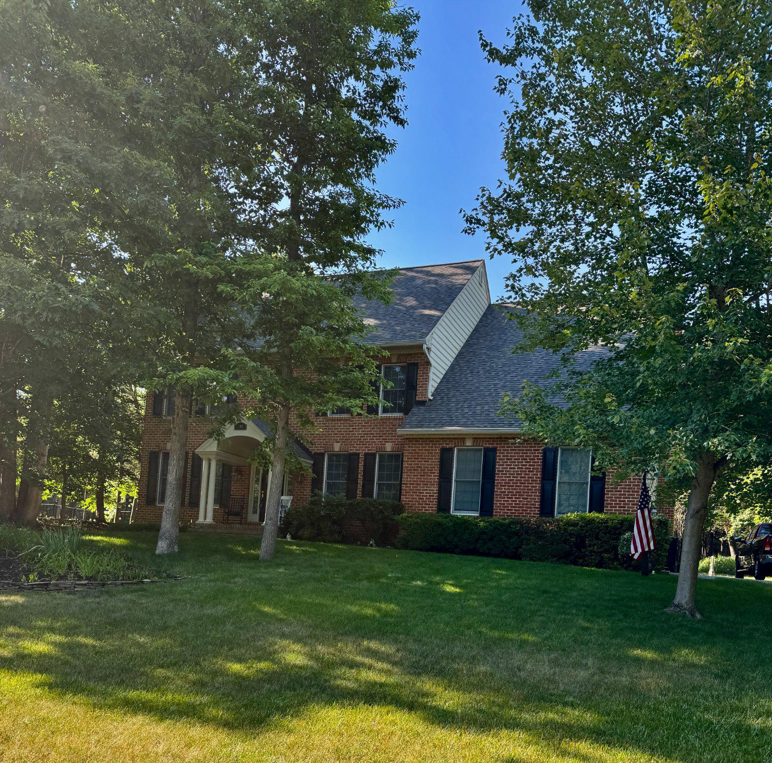 2600 Howard Grove Road Davidsonville, MD 21035 - Photo 2 of 2 Charming brick home with lush greenery.