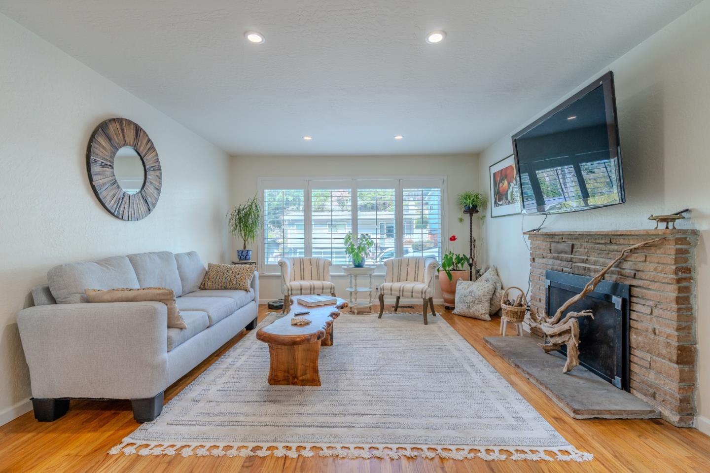 1080 Barcelona Drive Pacifica, CA 94044 - Photo 5 of 48 a living room with furniture and a fireplace