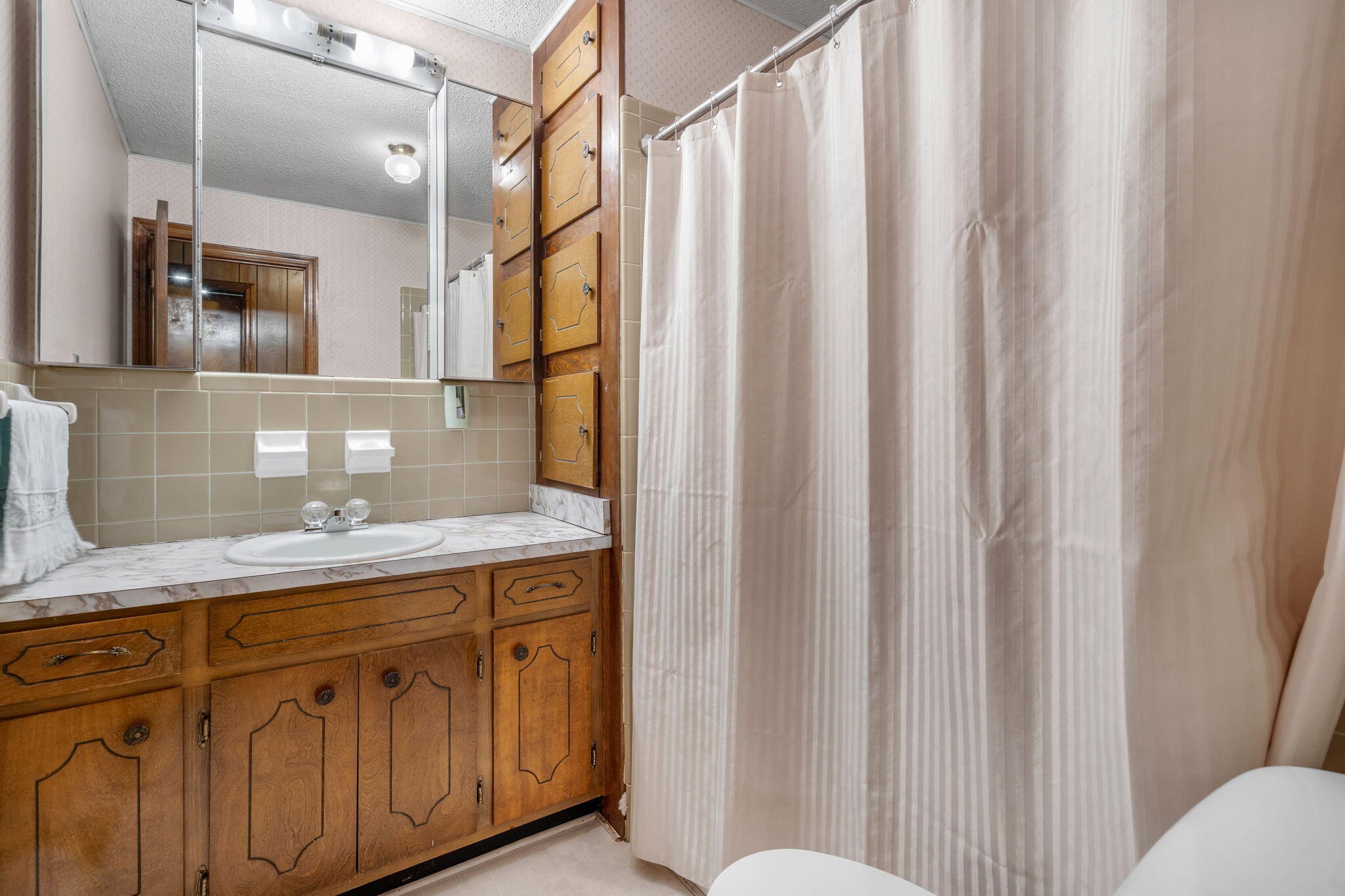 415 Parksville Road Benton, TN 37307 - Photo 12 of 34 a bathroom with a granite countertop sink and a mirror