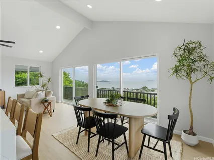 a view of a dining room with furniture window and outside view