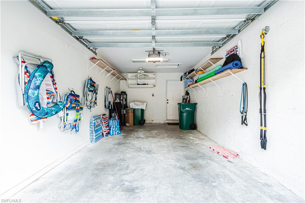 260 Robin Hood Circle, Unit 202 Naples, FL 34104 - Photo 4 of 28 a view of a hallway with a lot of stuff and toys