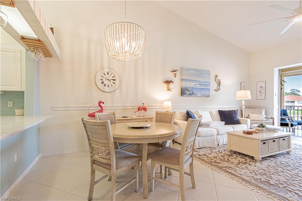 260 Robin Hood Circle, Unit 202 Naples, FL 34104 - Photo 8 of 28 a view of a dining room with furniture