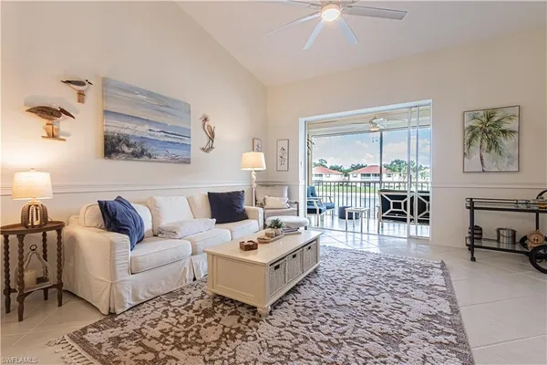 a living room with furniture and a rug