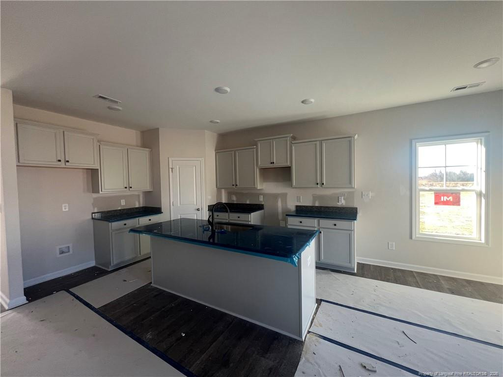4075 Blue Springs Road Red Springs, NC 28377 - Photo 11 of 28 a kitchen with a sink stove and refrigerator