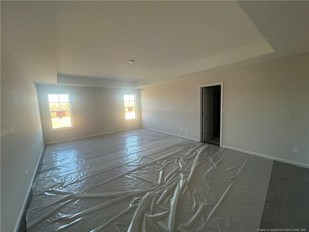 4075 Blue Springs Road Red Springs, NC 28377 - Photo 17 of 28 a view of an empty room and window and wooden floor