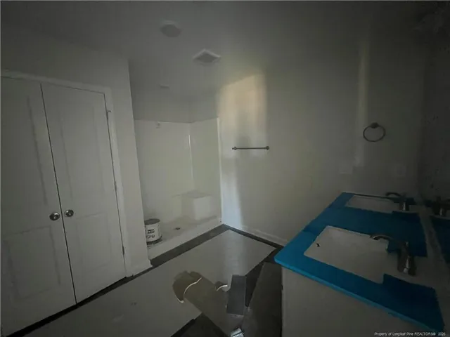 a view of an empty room and a window