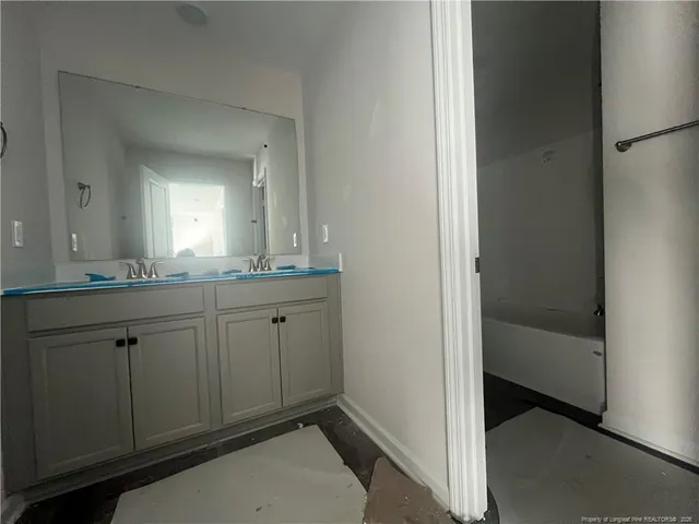 an empty room with windows and entrance