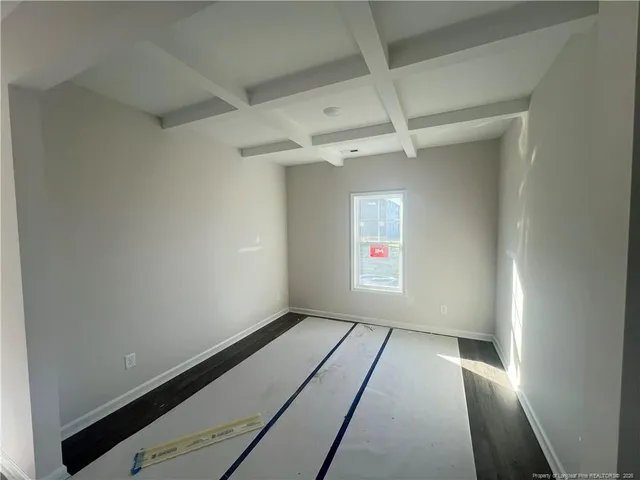 a kitchen with stainless steel appliances kitchen island granite countertop white cabinets and refrigerator