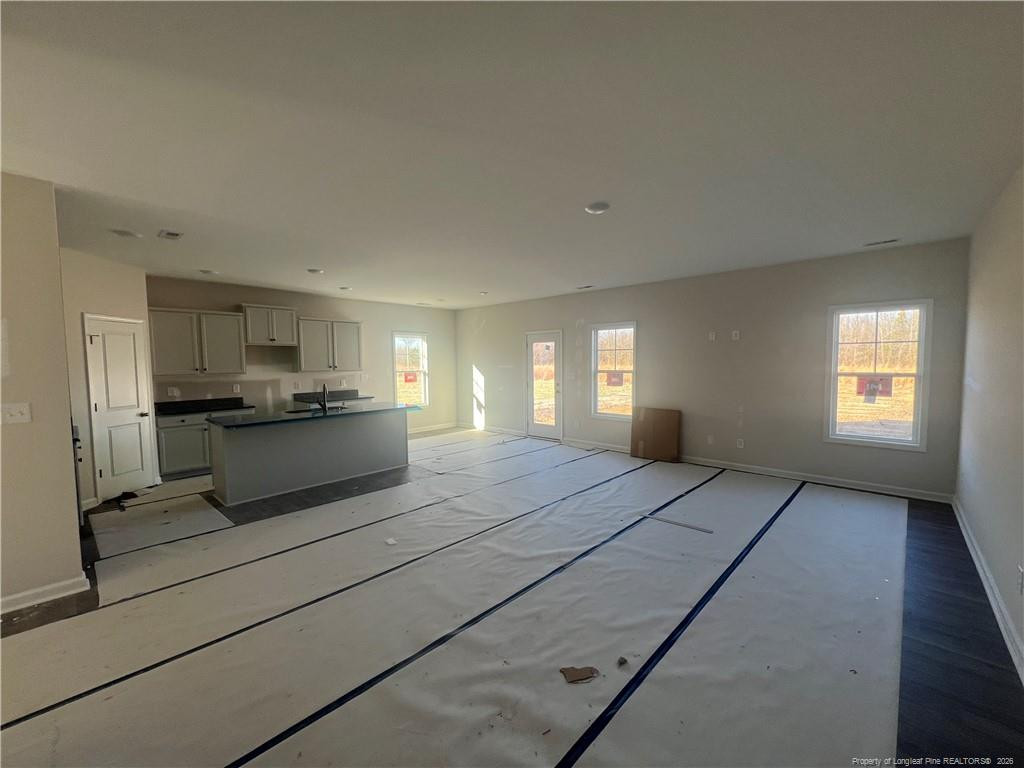 4075 Blue Springs Road Red Springs, NC 28377 - Photo 7 of 28 a view of kitchen and empty room with windows