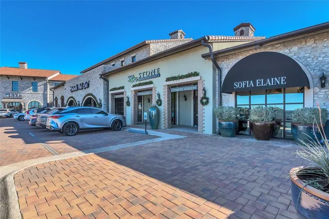 a front view of a building with parking