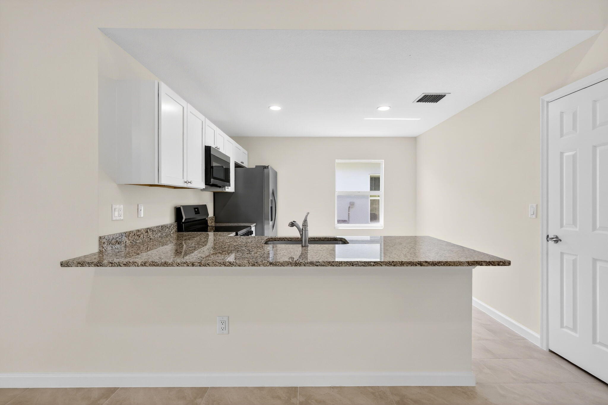 134 Southwest Seminole Crossing Southwest Indiantown, FL 34956 - Photo 9 of 27 134 KITCHEN 3