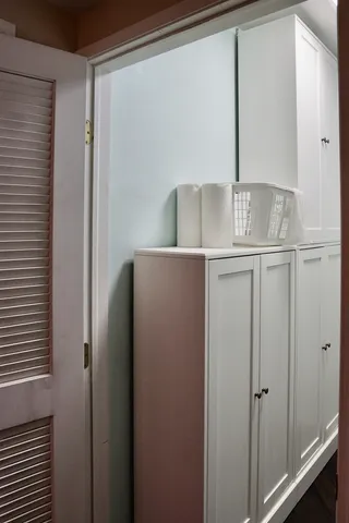 a bed room with a bed and a lamp