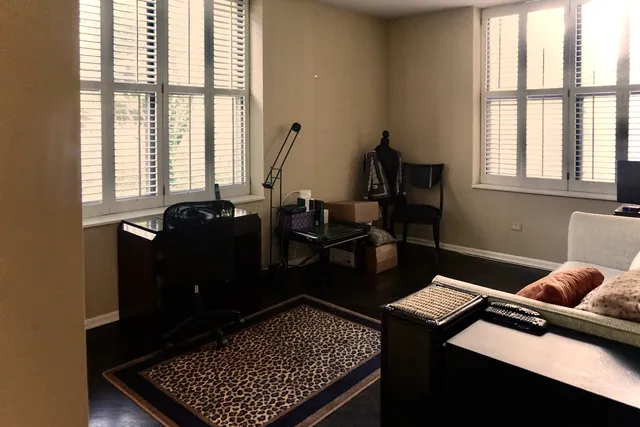 a living room with furniture rug and window