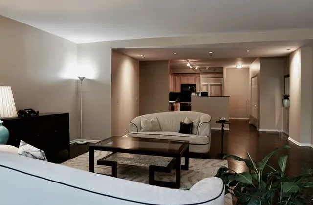 a living room with furniture and a table