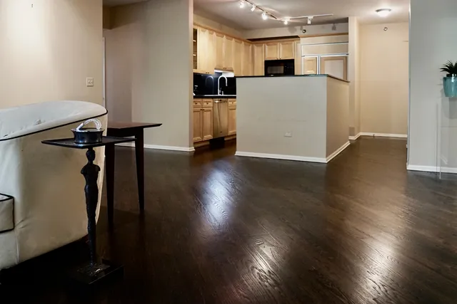 a view of kitchen and wooden floor