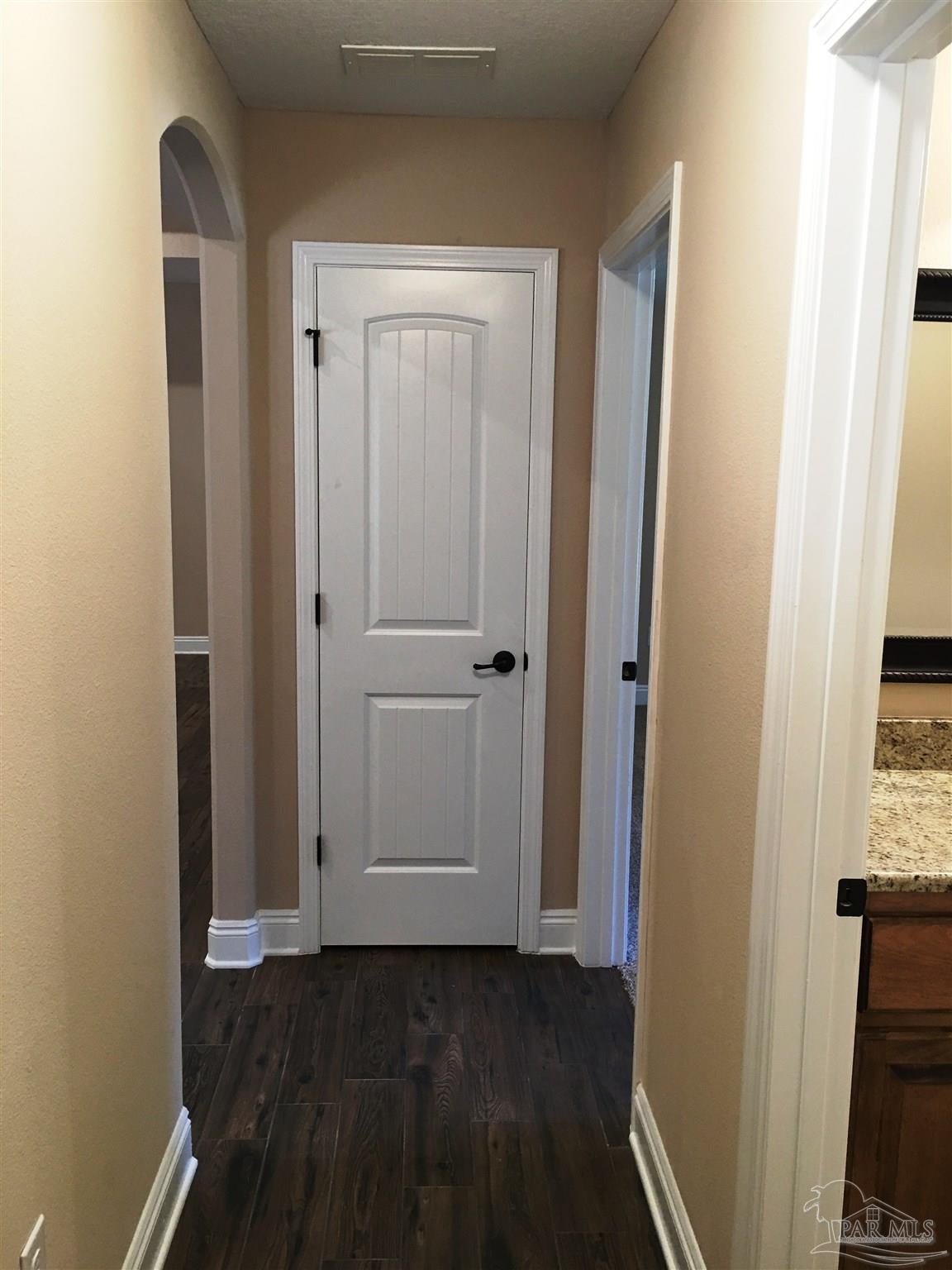 5294 South A Jones Road Milton, FL 32583 - Photo 17 of 35 Rear hall leads to 2 bedrooms/1 bath & patio door.