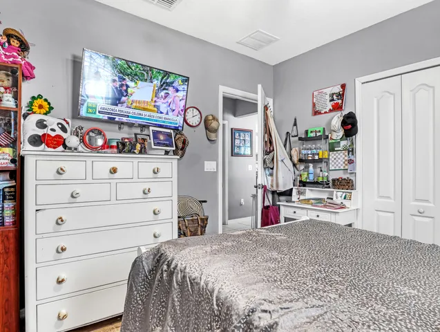 a bedroom with a bed and closet
