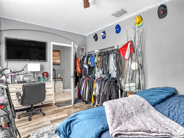 a bedroom with furniture and white walls