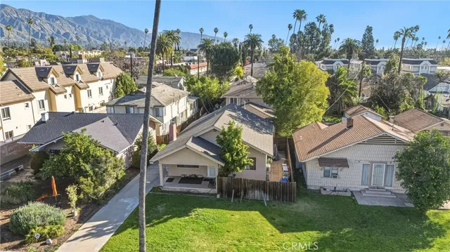 a aerial view of a house with a yard