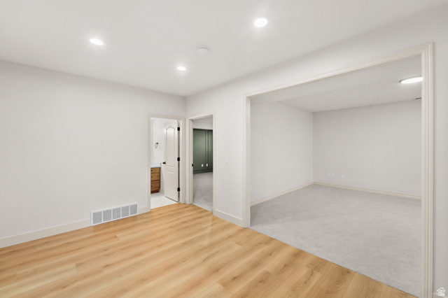 340 Brayden Way Draper, UT 84020 - Photo 45 of 58 Recessed lighting, wood-finish flooring, white trim, and a doorway to a separate room with carpet