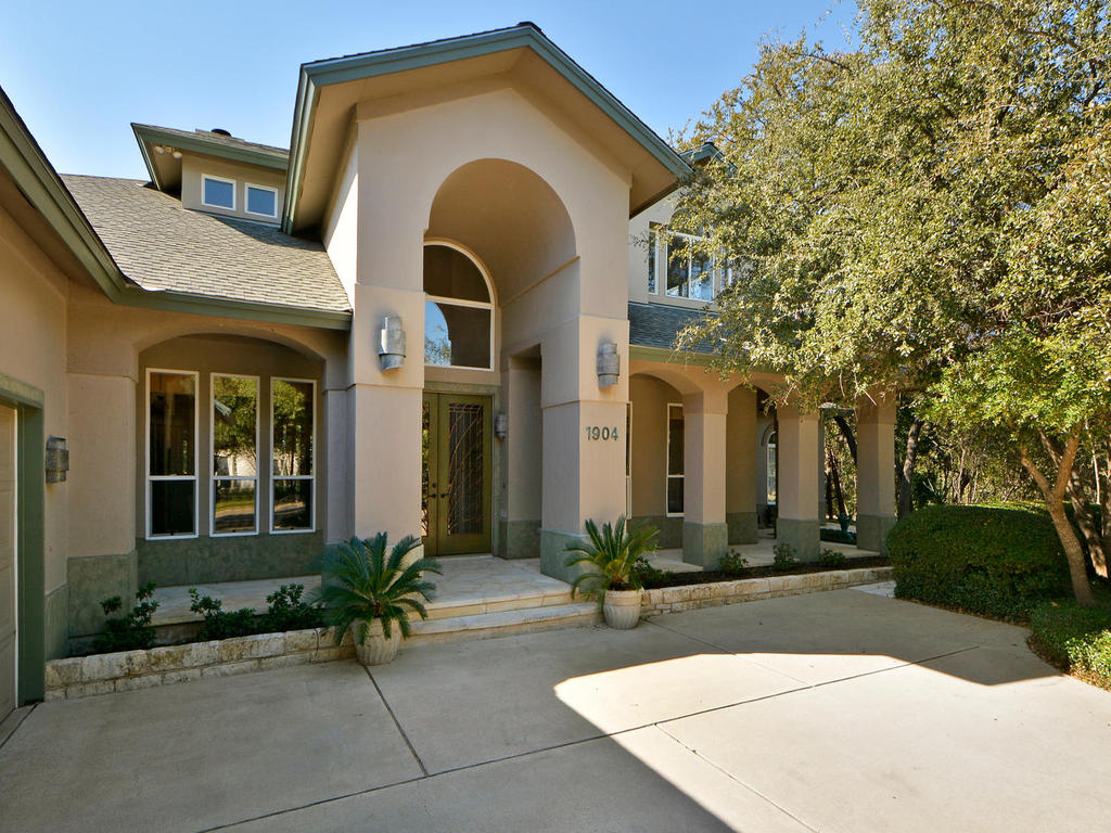 a front view of a house with yard
