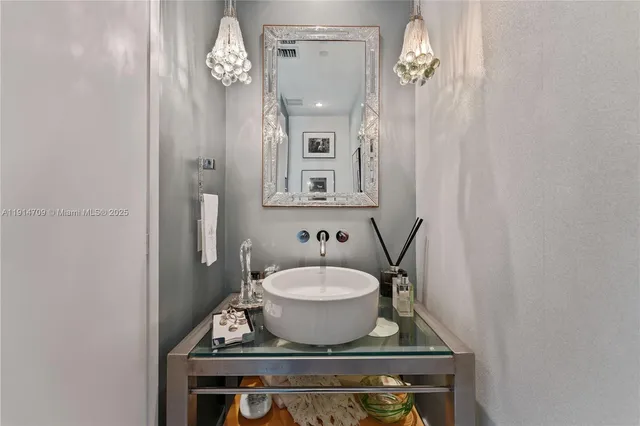 a bathroom with a sink a mirror and a toilet