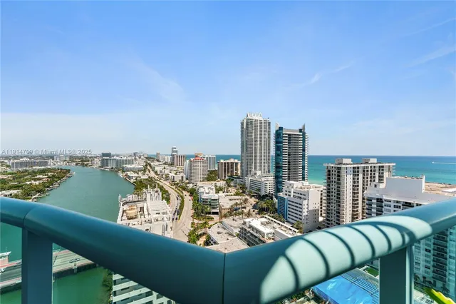 a view of balcony with couch and ocean view