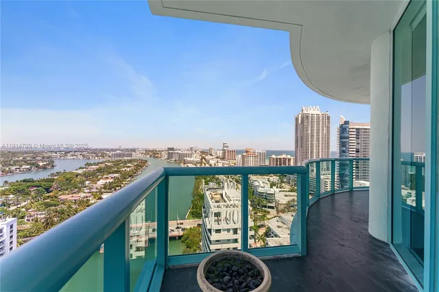 a view of a balcony with an ocean view