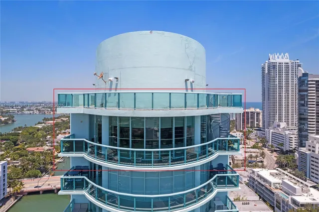 a view of roof deck with furniture and city view