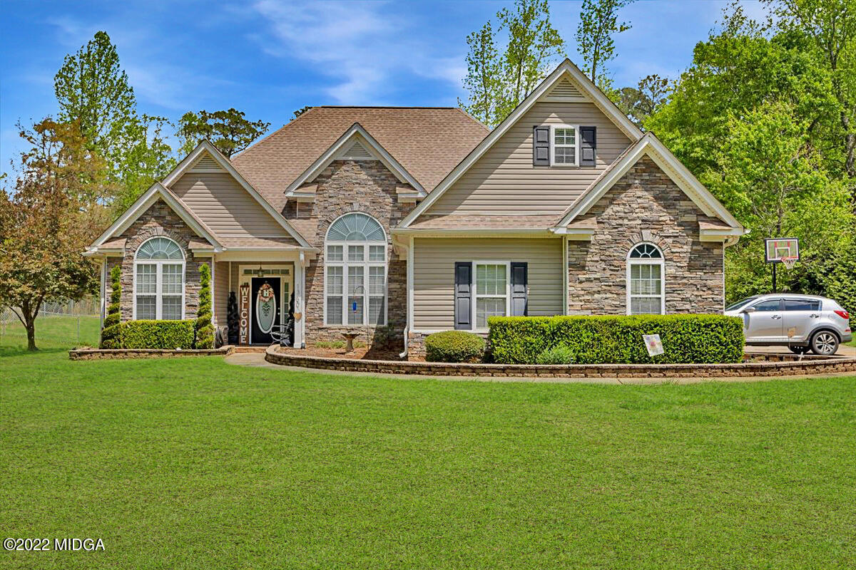 1360 Patterson Road Griffin, GA 30223 - Photo 1 of 24 a front view of a house with a yard