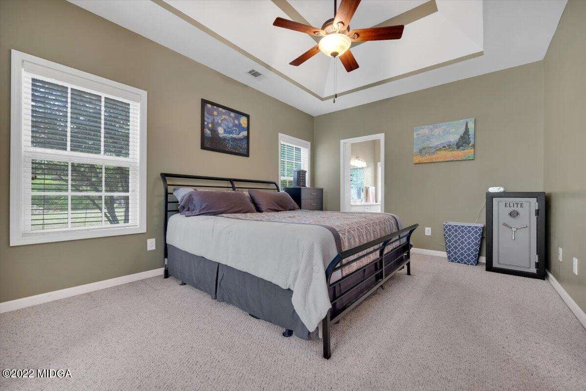 1360 Patterson Road Griffin, GA 30223 - Photo 18 of 24 a bedroom with a bed dresser and a window