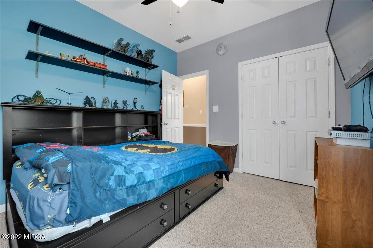 1360 Patterson Road Griffin, GA 30223 - Photo 20 of 24 a bedroom with a bed and a window