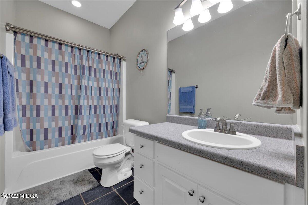 1360 Patterson Road Griffin, GA 30223 - Photo 21 of 24 a bathroom with a sink toilet and shower