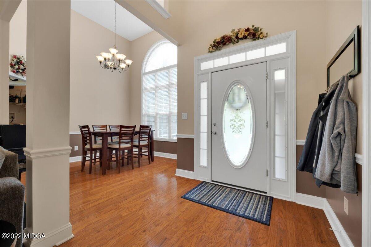 1360 Patterson Road Griffin, GA 30223 - Photo 4 of 24 a view of a livingroom with furniture window wooden floor and a chandelier